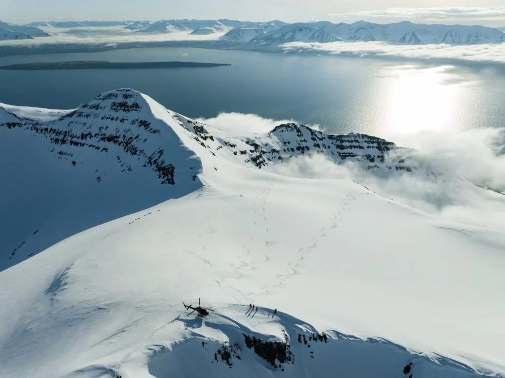 helicopter snowcapped mountains sunny day