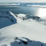 helicopter snowcapped mountains sunny day