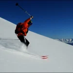 skier carving mountain slope