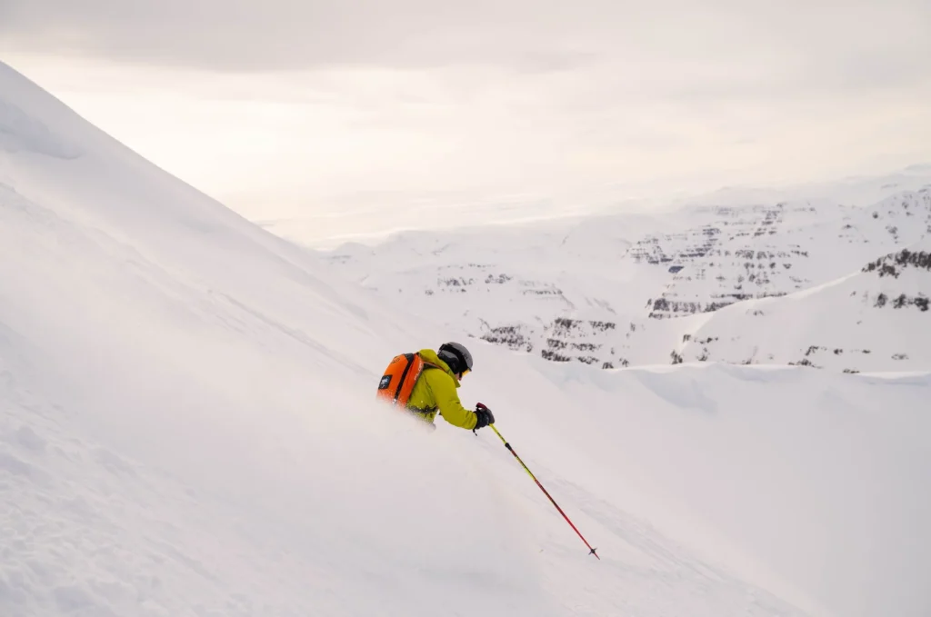 skier carving snowy mountain slope