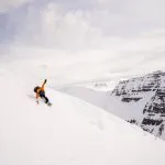 snowboarder carving mountain slope