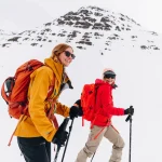women mountain hiking snow